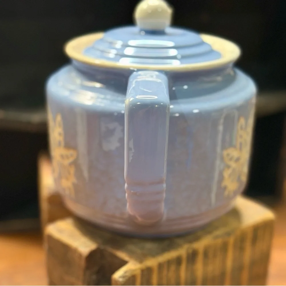 Vintage Blue Ceramic Teapot with Floral Design and Lid